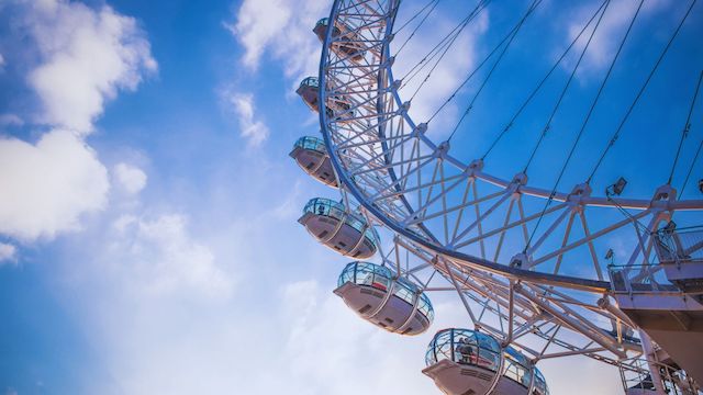 the London Eye against a bright blue sky