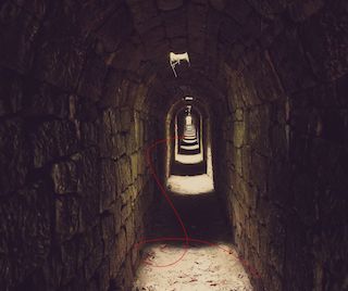 red string running through underground tunnel
