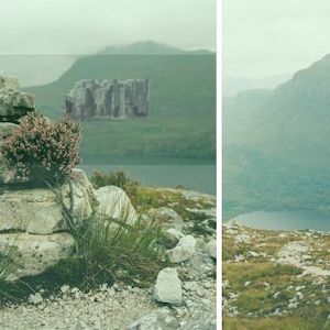 view of a Gothic castle from across a misty lake